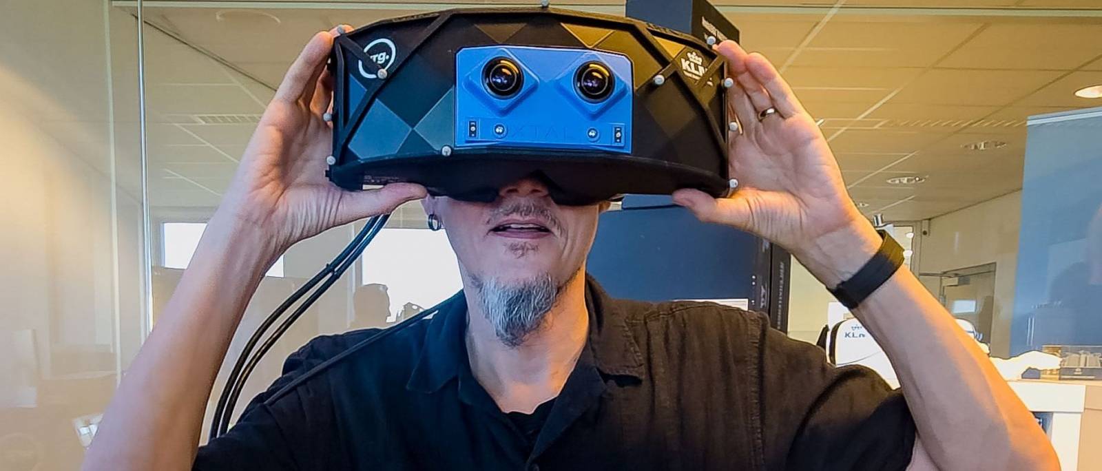 A person testing large XR glasses.