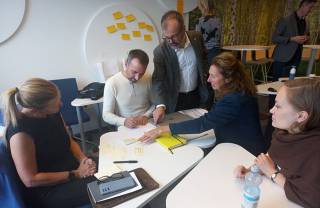 People team-working in a classroom. 