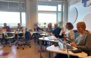 People sitting in a classroom. 