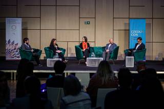 A panel discussion on stage.