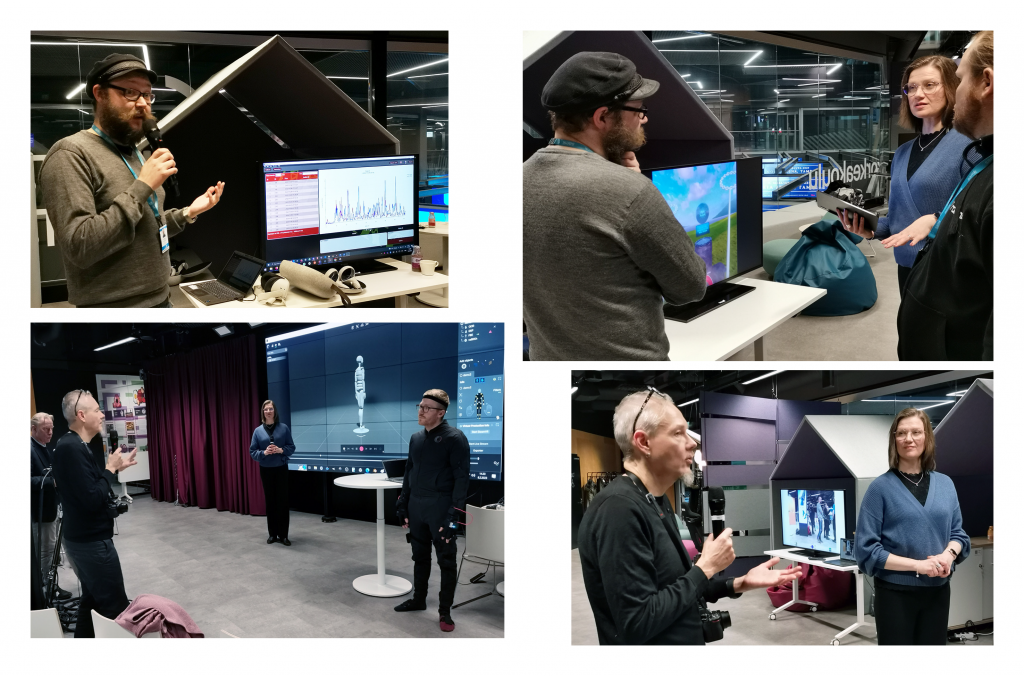 Ihmisiä kokeilemassa virtuaalikuntoutusdemoja.