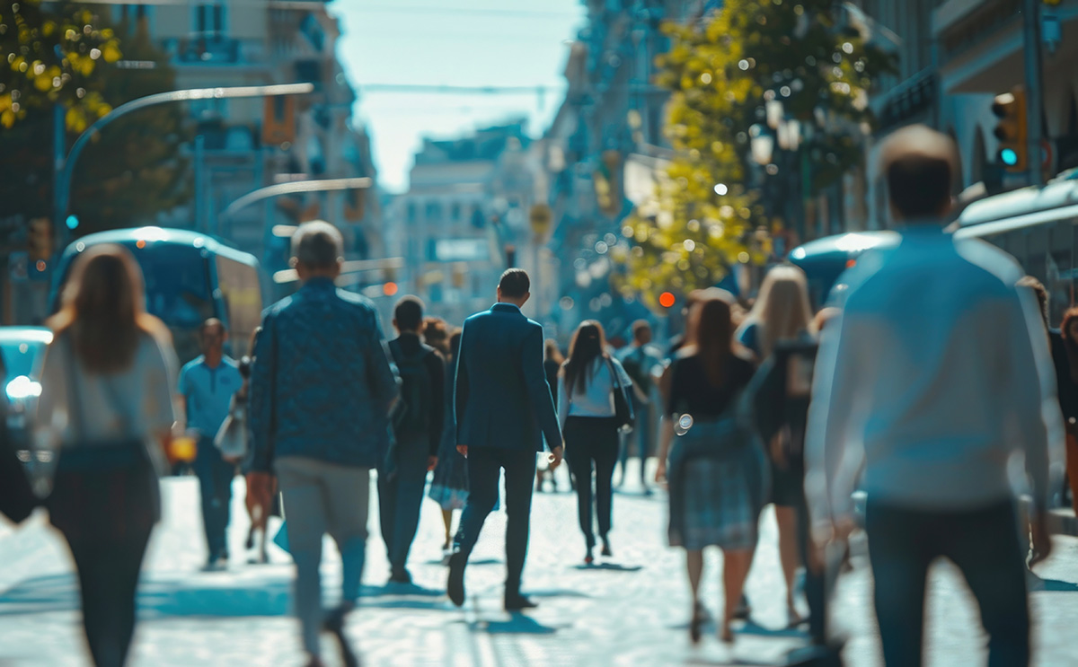 A group of people walking down a city street. Urban lifestyle concept.