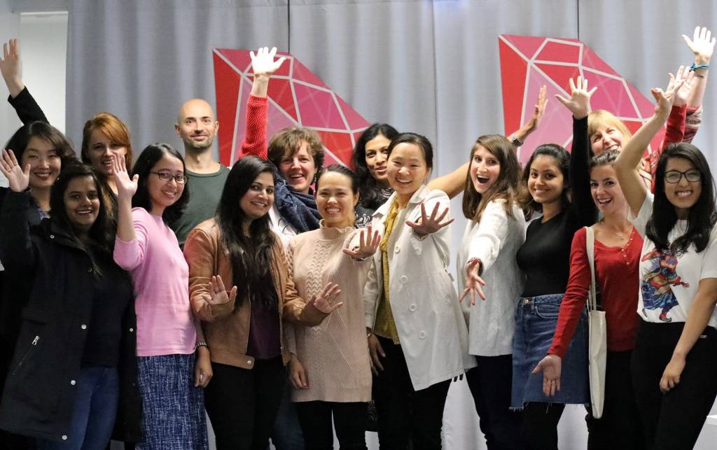 Hidden Gems spouses smiling and waving