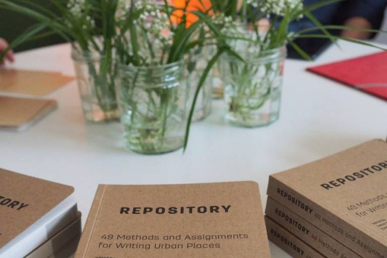 Books on table with flowers.