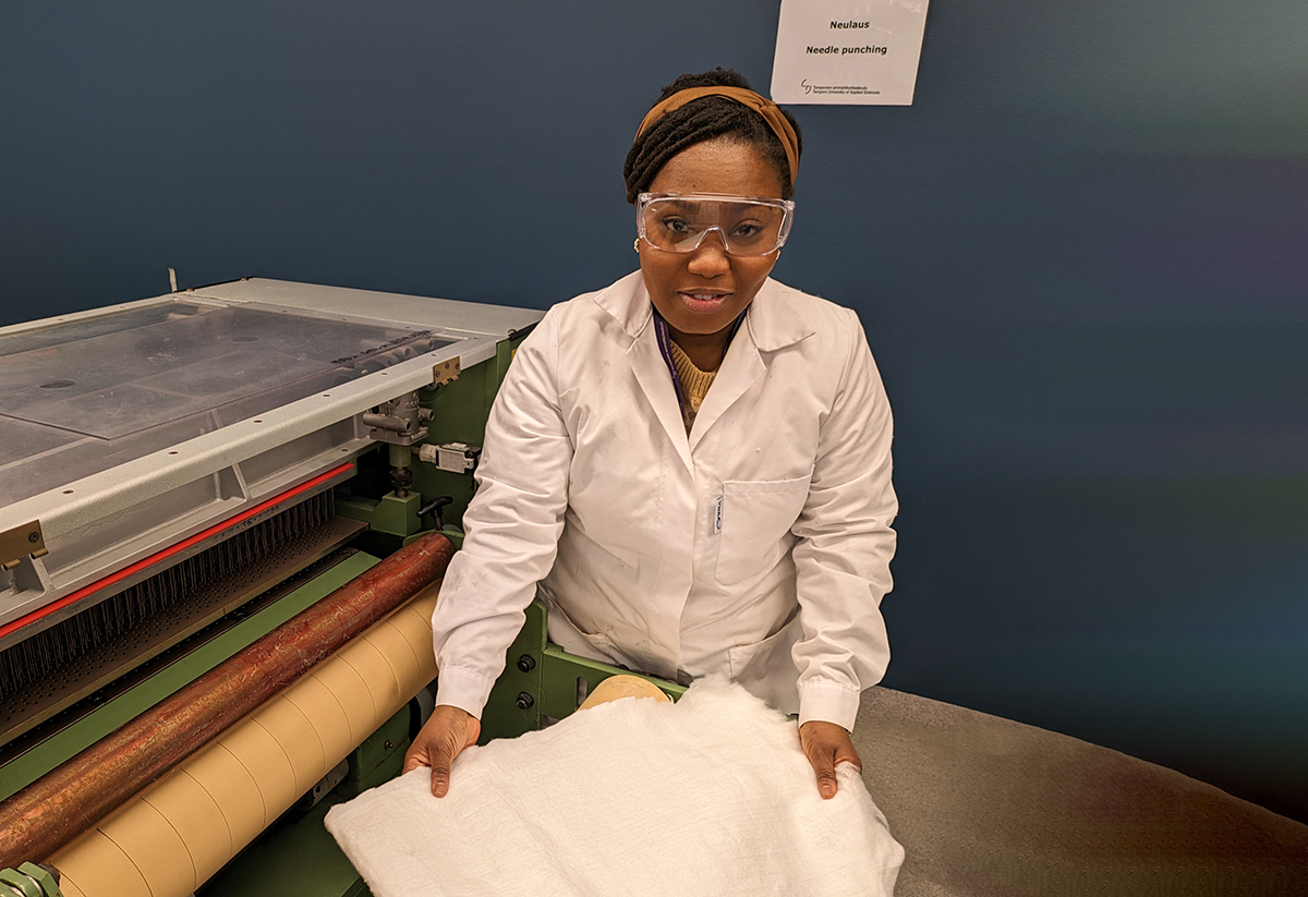 Young woman in a textile lab.