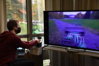 A person operating a vehicle remotely.