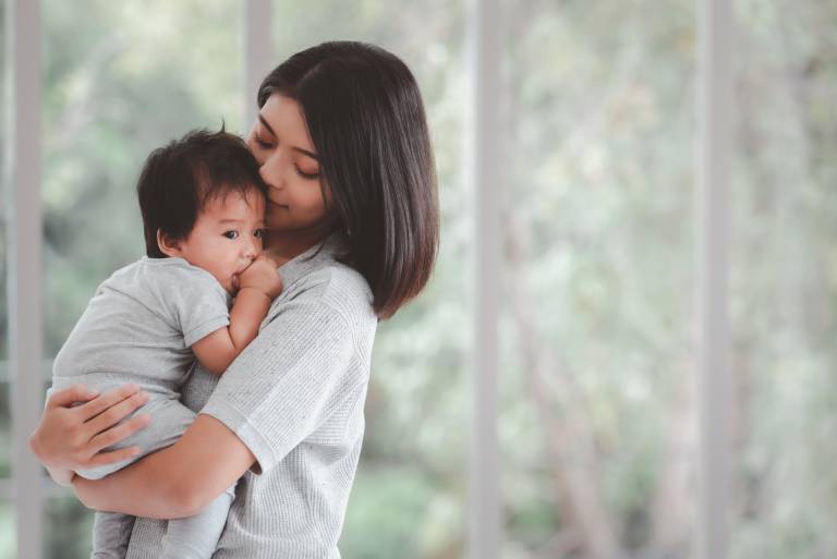 Mother holding her baby.