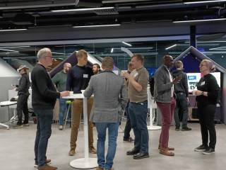 People standing and talking to each others.