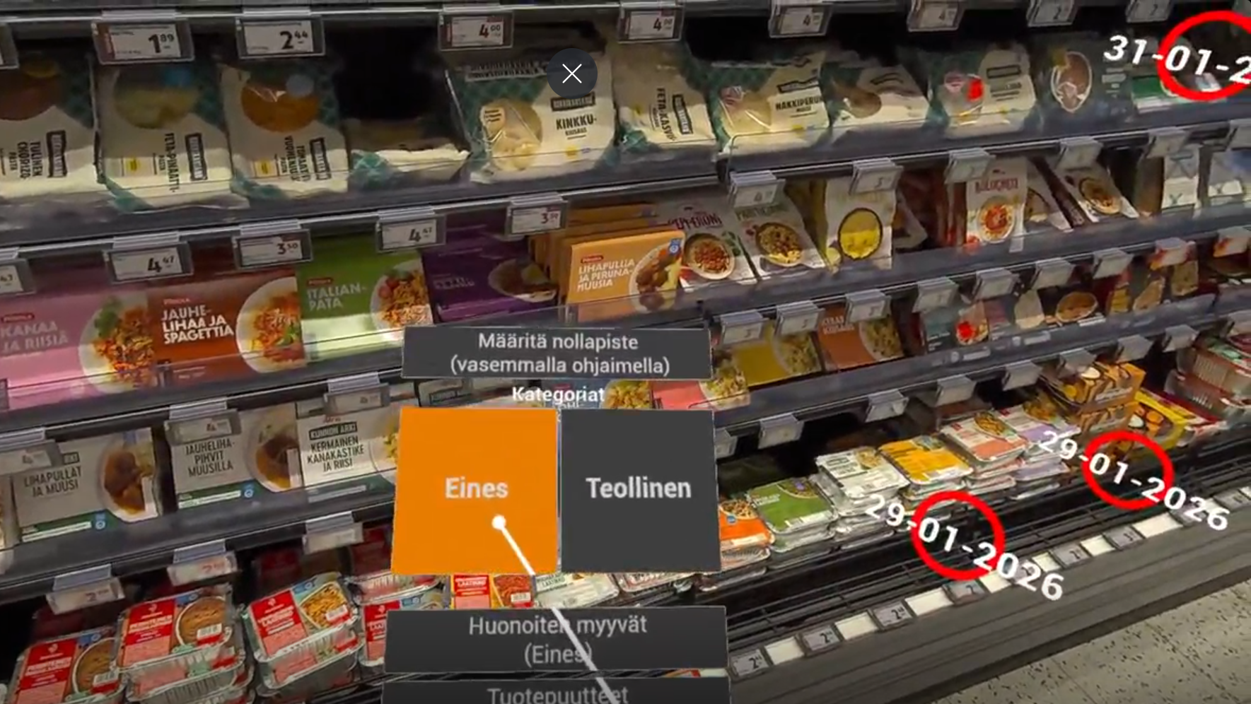 Kaupantuotehylly, jonka edessä näkyy valintalaatikoita ja kursori, jolla tehdä valinnat, mitkä tuotteet sovellus näyttää hyllyllä ympyröitynä.