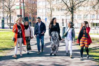 Group photo of all members of UnMaking Knowledge research team, walking in a park.