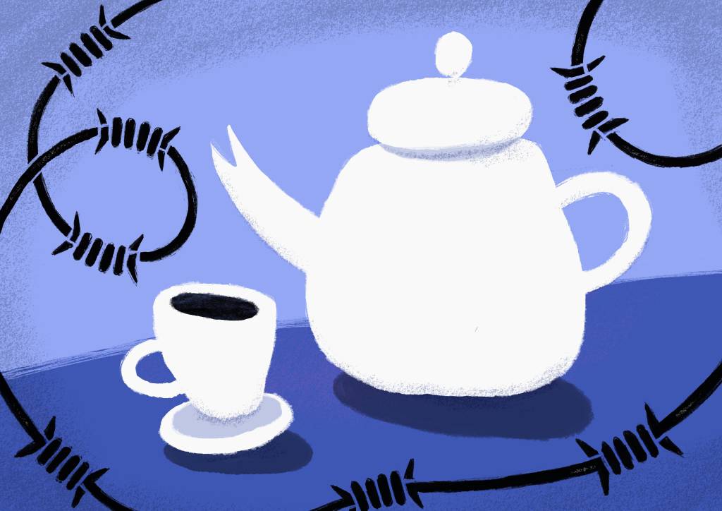 A white teapot and a tea cup with coffee on a table with a blue cloth against a blue background. The teapot and cup are surrounded by barbed wire.