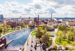 Summer view of Tammerkoski rapids and industrial buildings. 