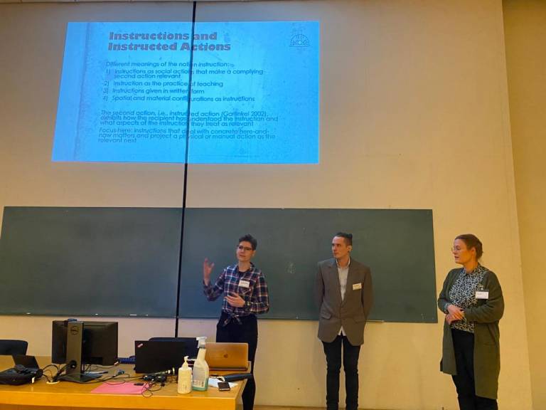 Project members giving a talk at a conference