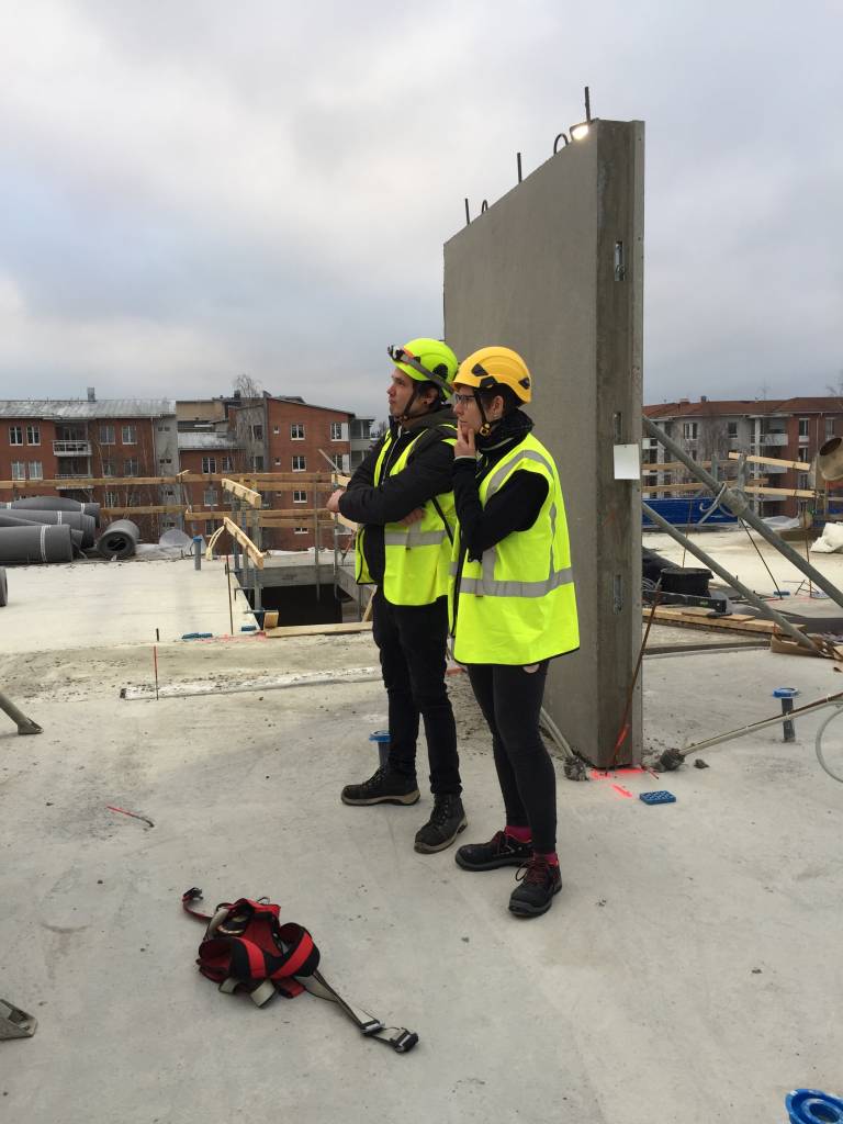 Two researchers at a construction site