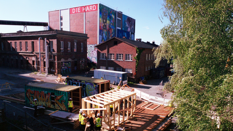 Landscape of Hiedanranta with buildings, graffiti and construction work.