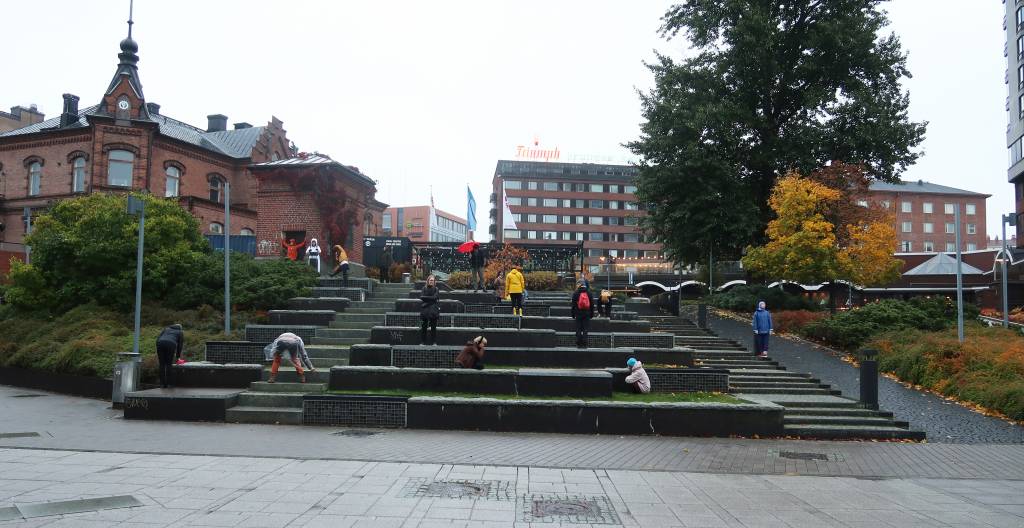 People settling on urban stairs in Tampere.
