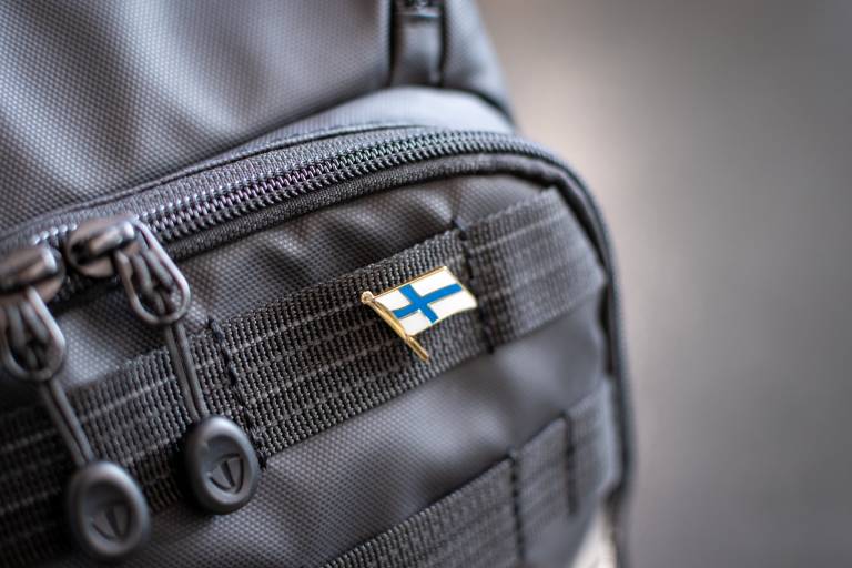 A backbag with a Finnish flag on it. Photo by Unsplash.